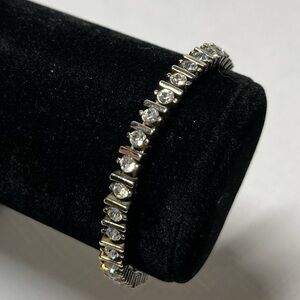 Vintage silver-tone tennis bracelet crystals. Substantial weight. Strong clasp.